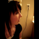 An Emo-type girl videotapes herself sitting on a toilet. When she is interrupted, she tells her mother that she is pooping, but we cannot hear anything.